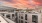 Sunset view of a rooftop seating area