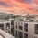 Sunset view of a rooftop seating area