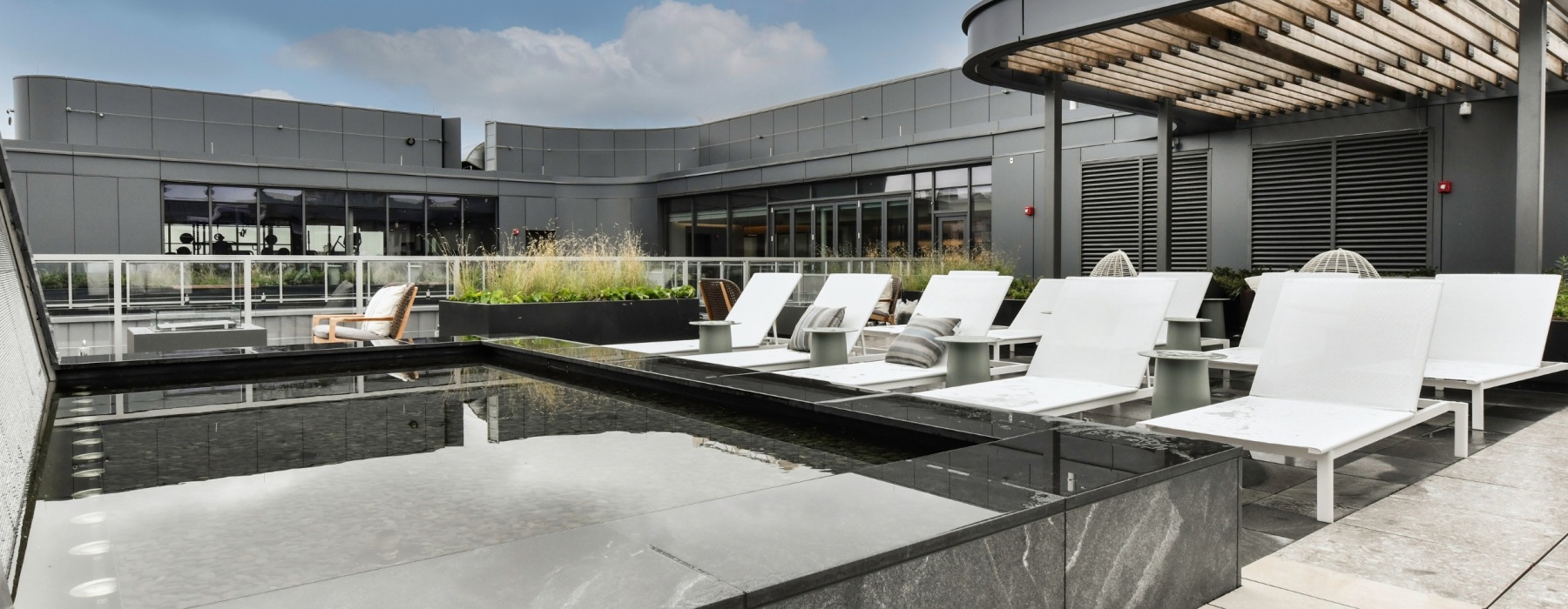 Rooftop seating area with water feature