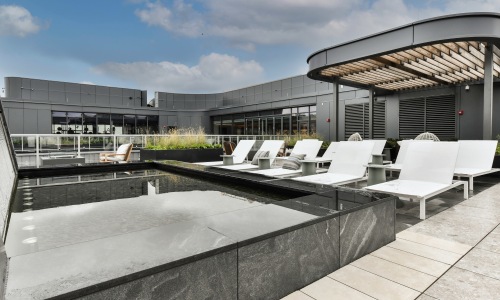 Rooftop seating area with water feature